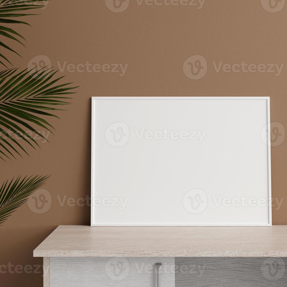 Minimalist front view horizontal white photo or poster frame mockup leaning against wall on table with plant. 3d rendering.