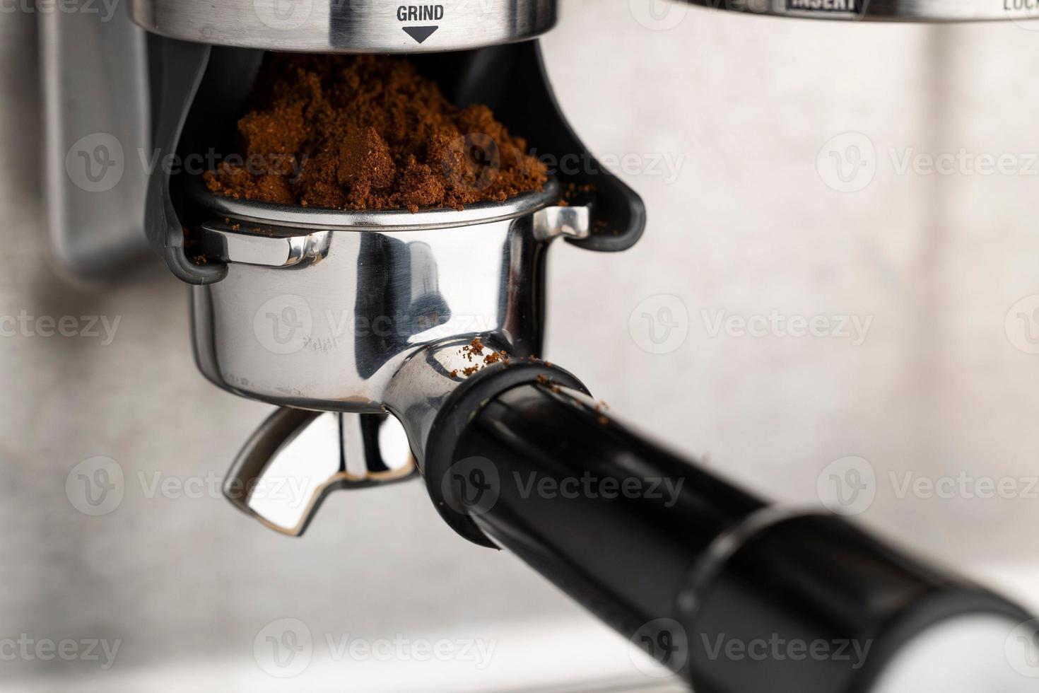 A closeup shot of an espresso coffee machine photo