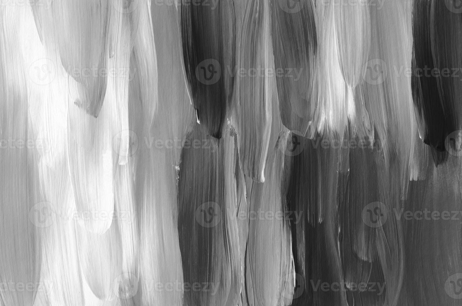 Abstract black and white textured background. Minimalistic monochrome backdrop. Brush strokes on paper, hand painted photo