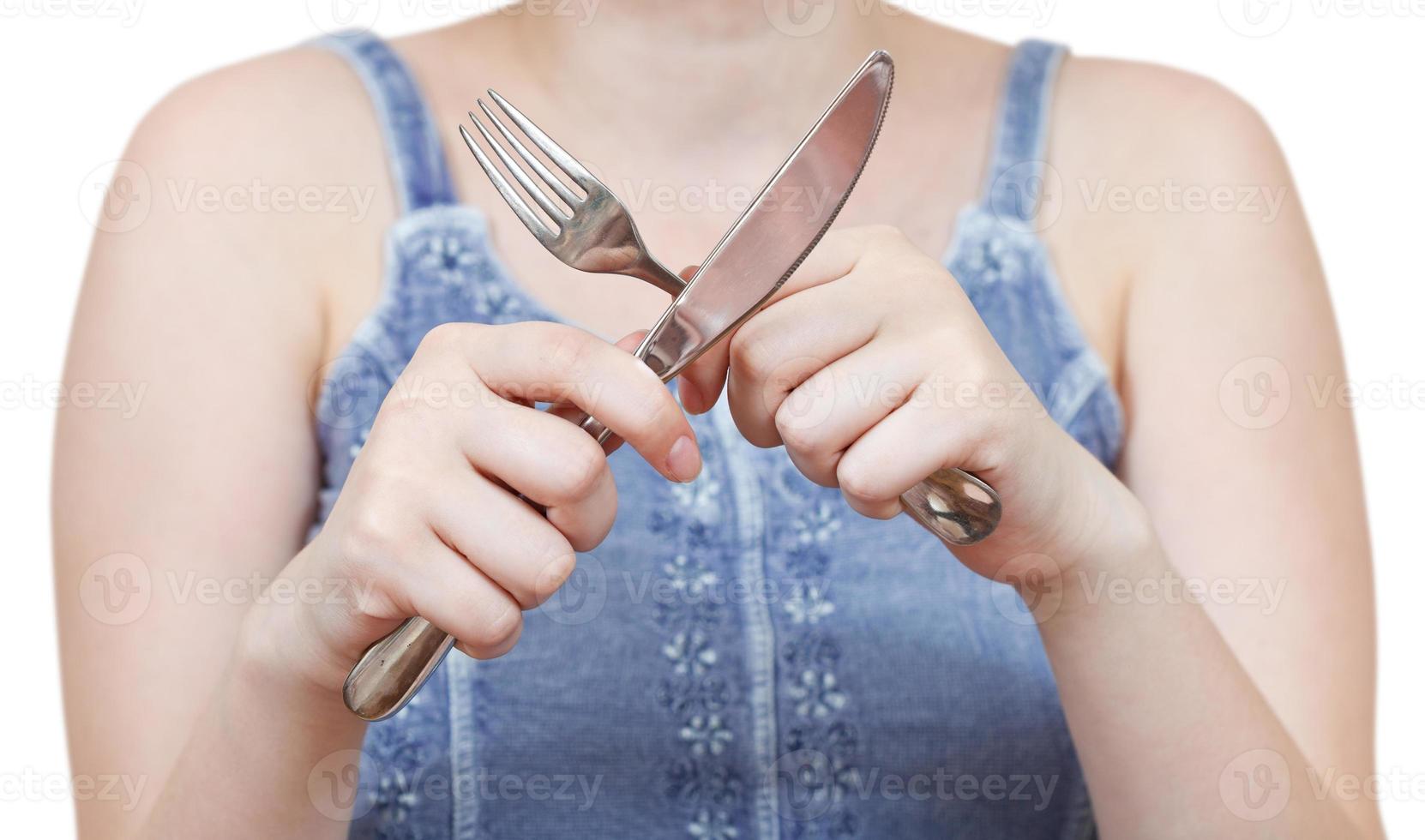 crossing fork and table knife in hands 12041130 Stock Photo at Vecteezy