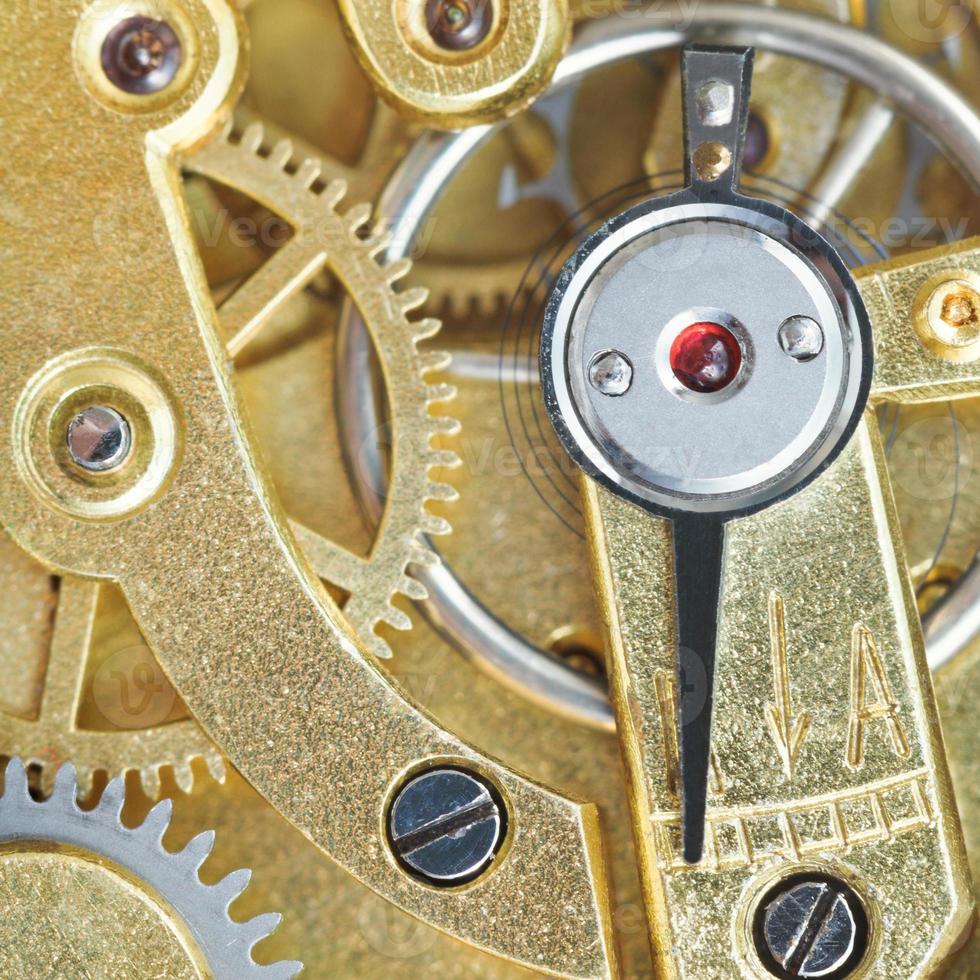 brass mechanical clockwork of vintage clock photo