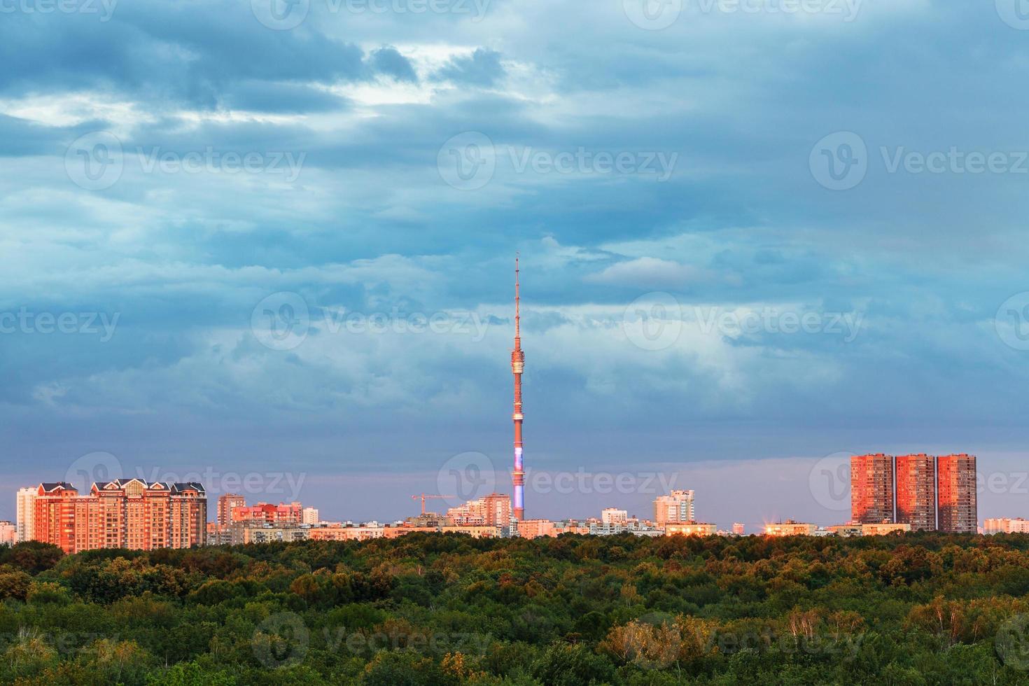 woods and illuminated by pink sunset light city photo