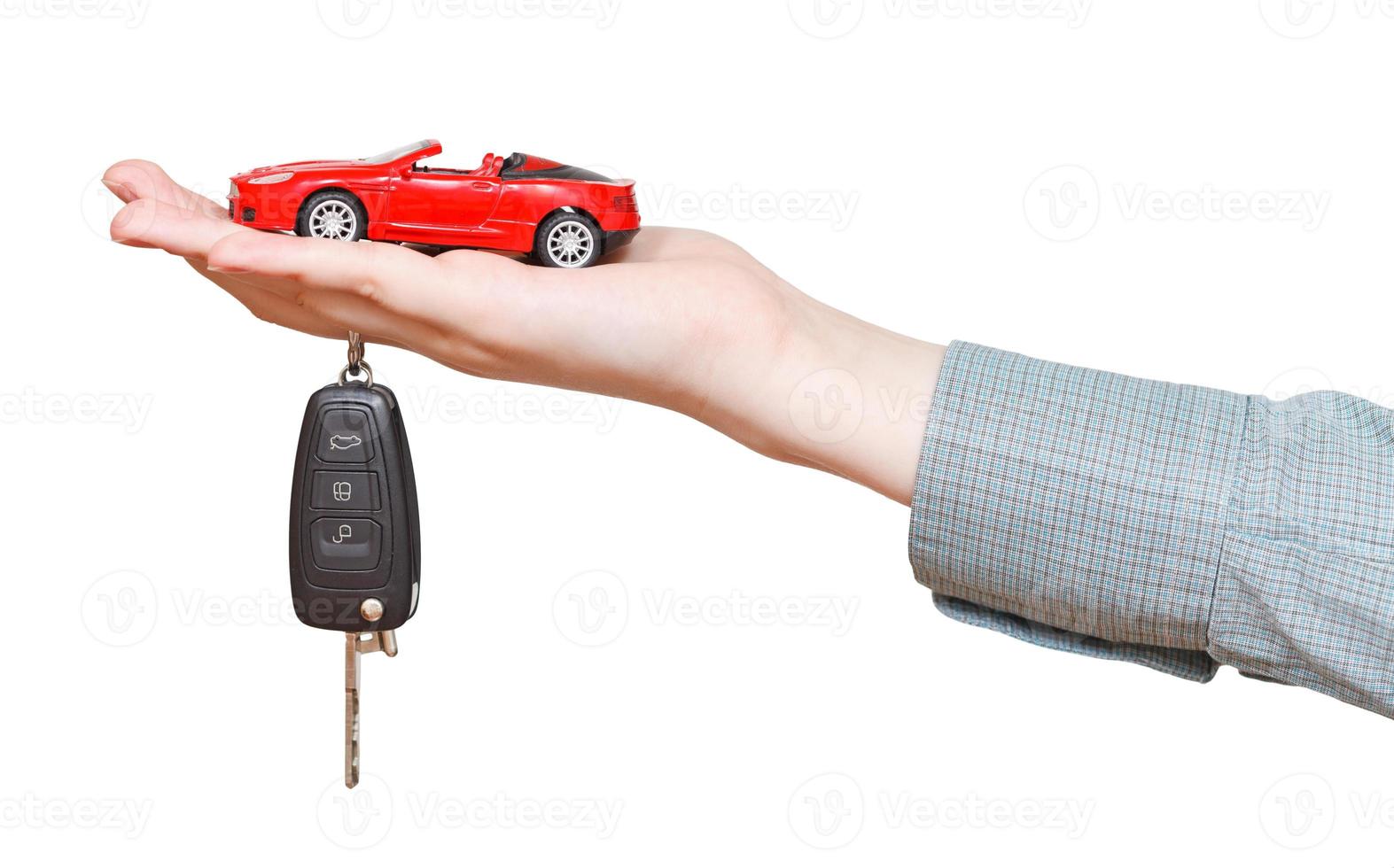 new red car with key on hand isolated photo