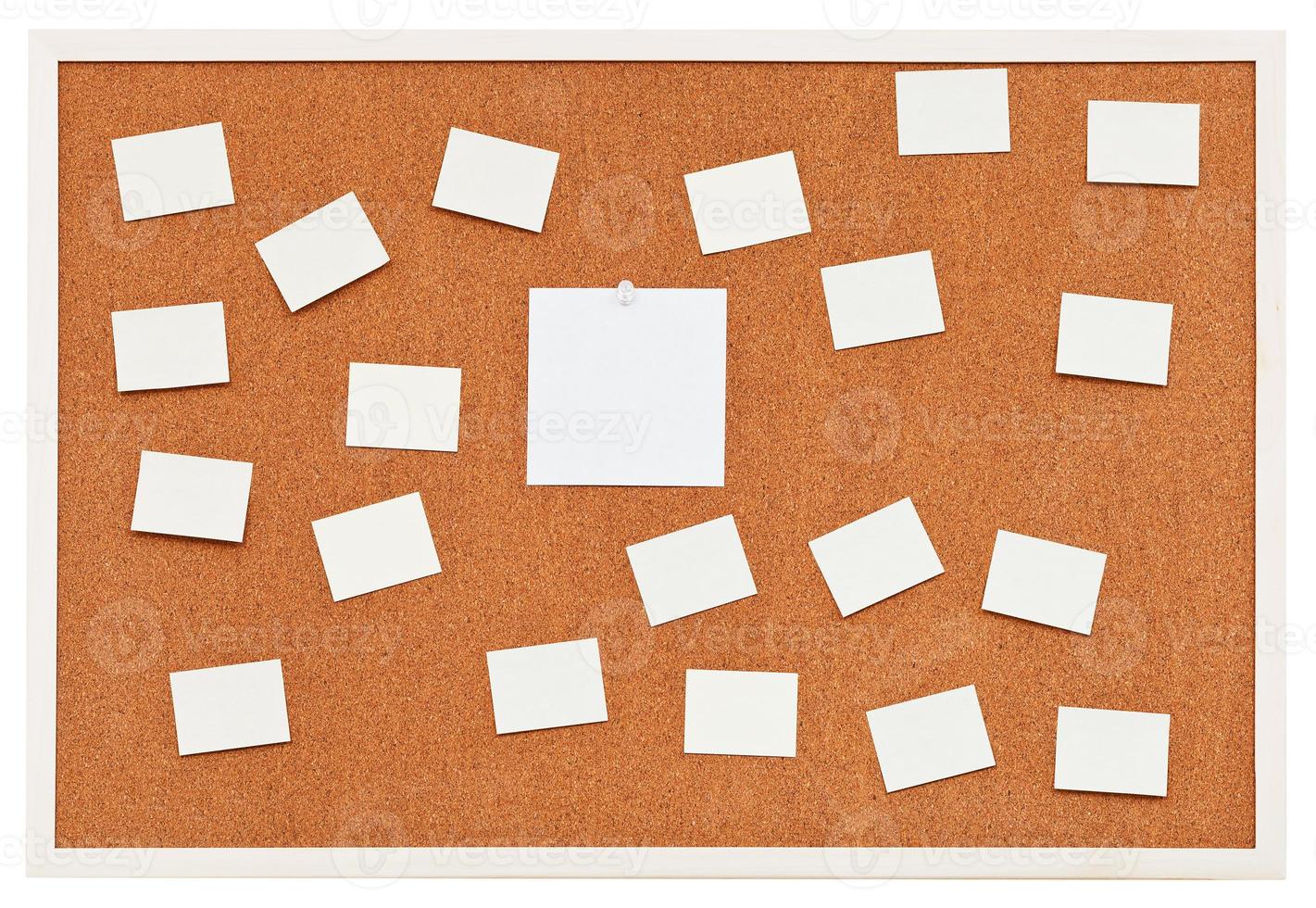 small sheets of paper on bulletin cork board photo