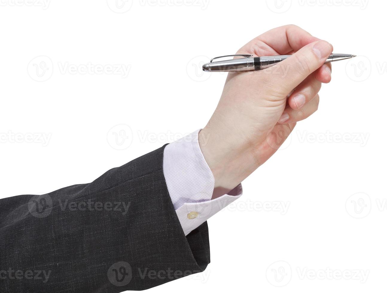 side view of businessman hand with silver pen photo