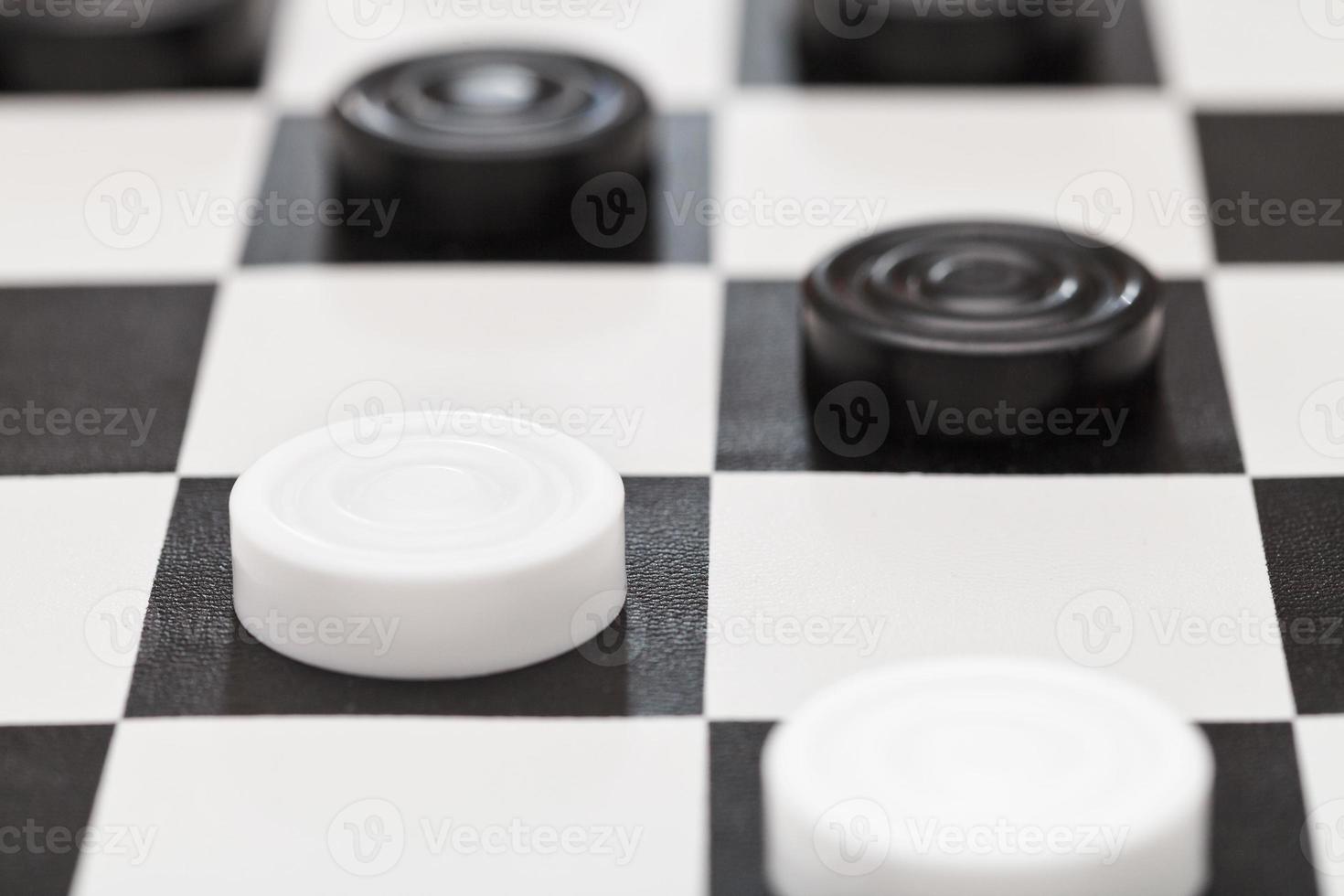 draughts on black and white vinyl board photo
