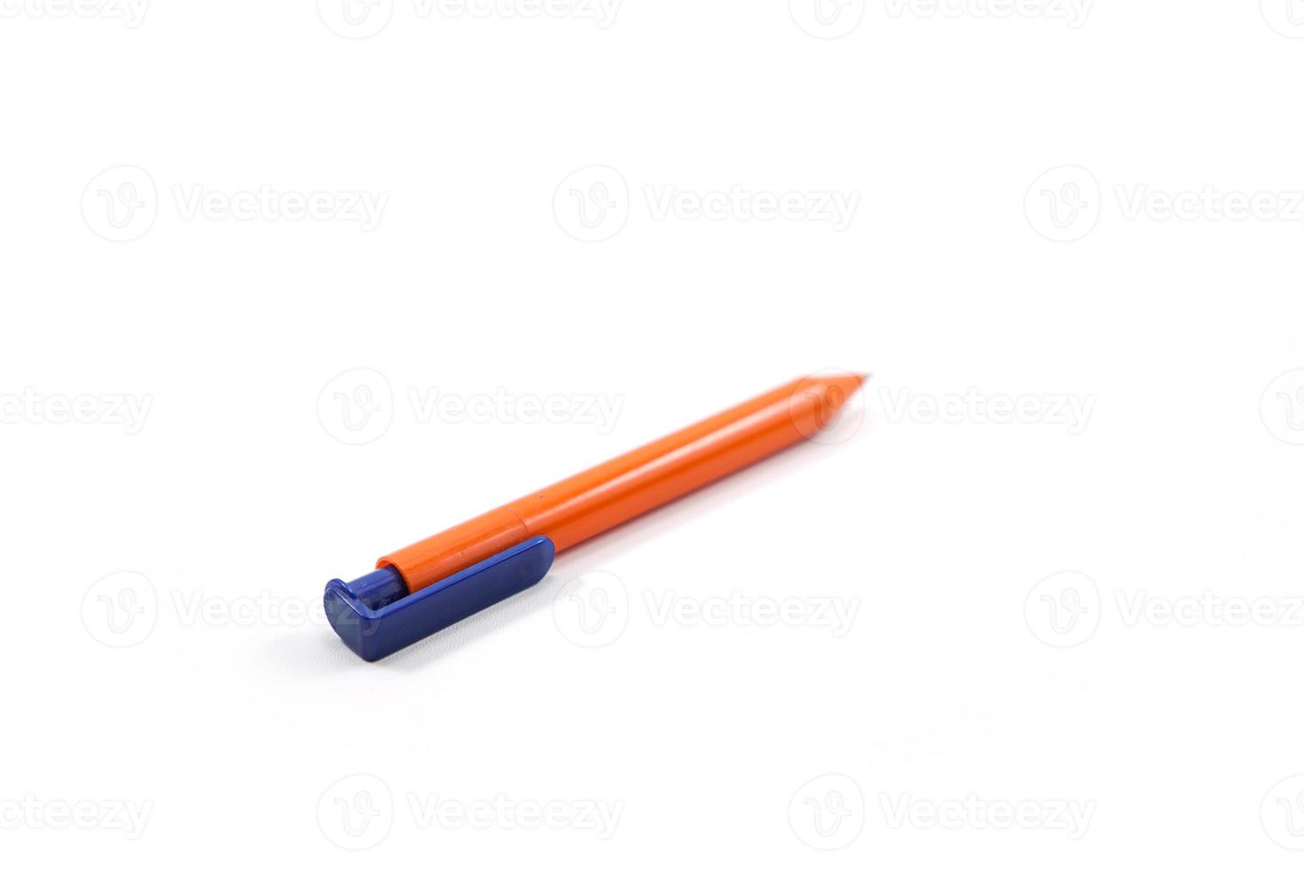 orange and blue plastic pen isolated on white photo