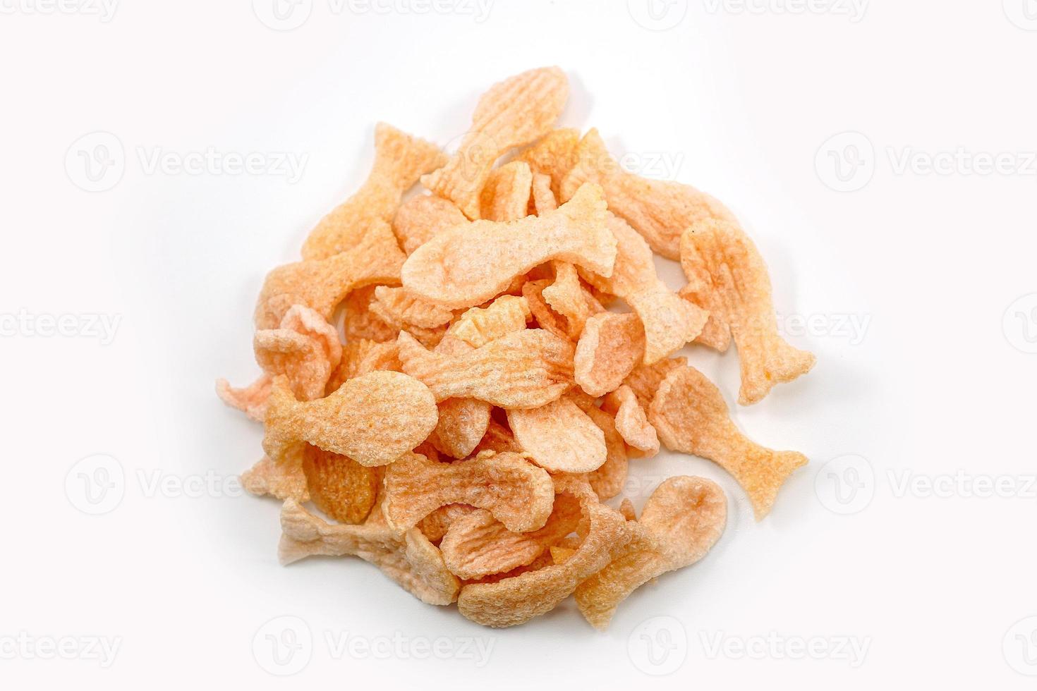 Fried prawn crackers or shrimp crackers in the shape of red fish photo