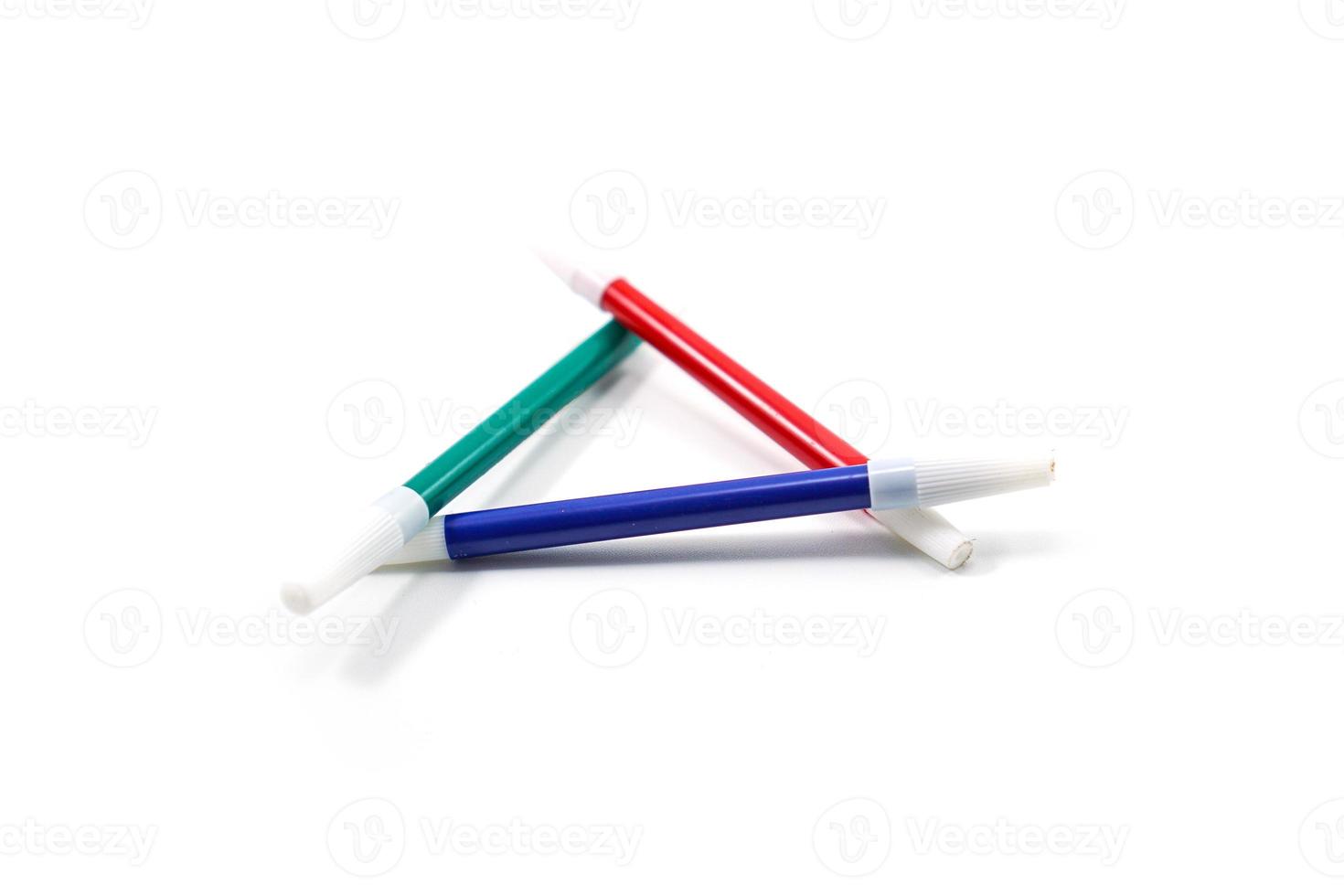 conceptual green, red, and blue triangular markers isolated on white photo