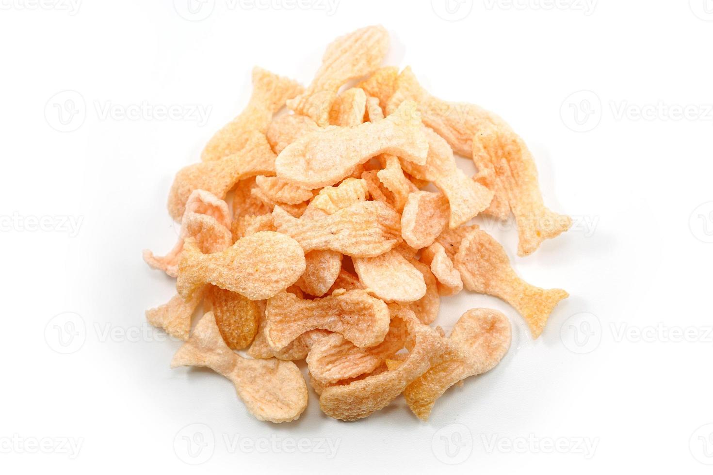 Fried prawn crackers or shrimp crackers in the shape of red fish photo
