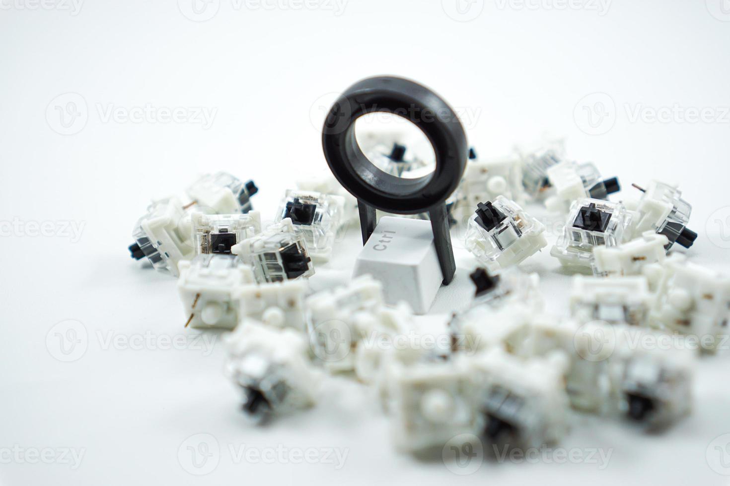 keycap puller with mechanical keyboard keycaps and black mechanical switch keys photo