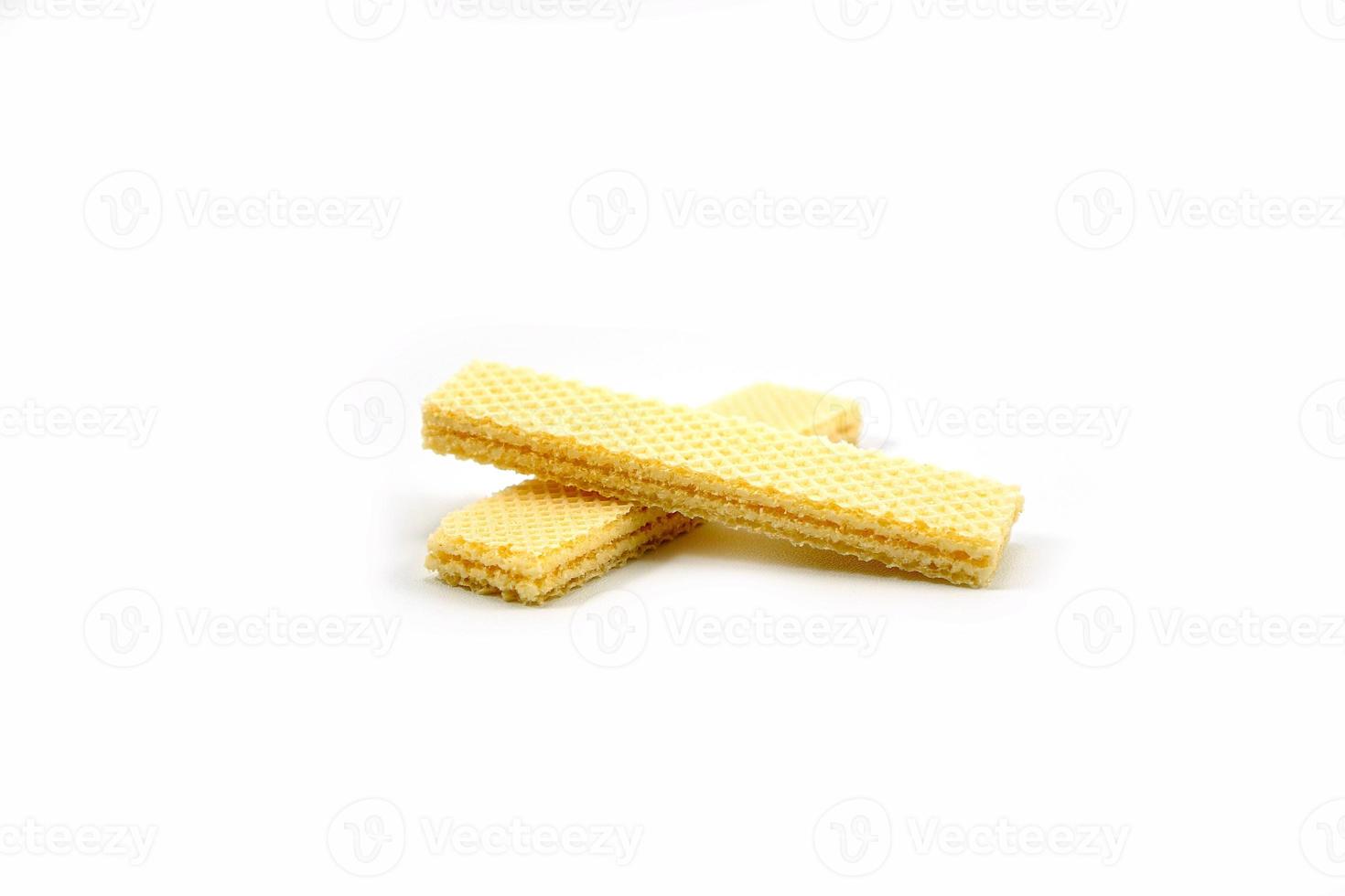Delicious wafer sticks arranged in a pyramid shape isolated on a white photo