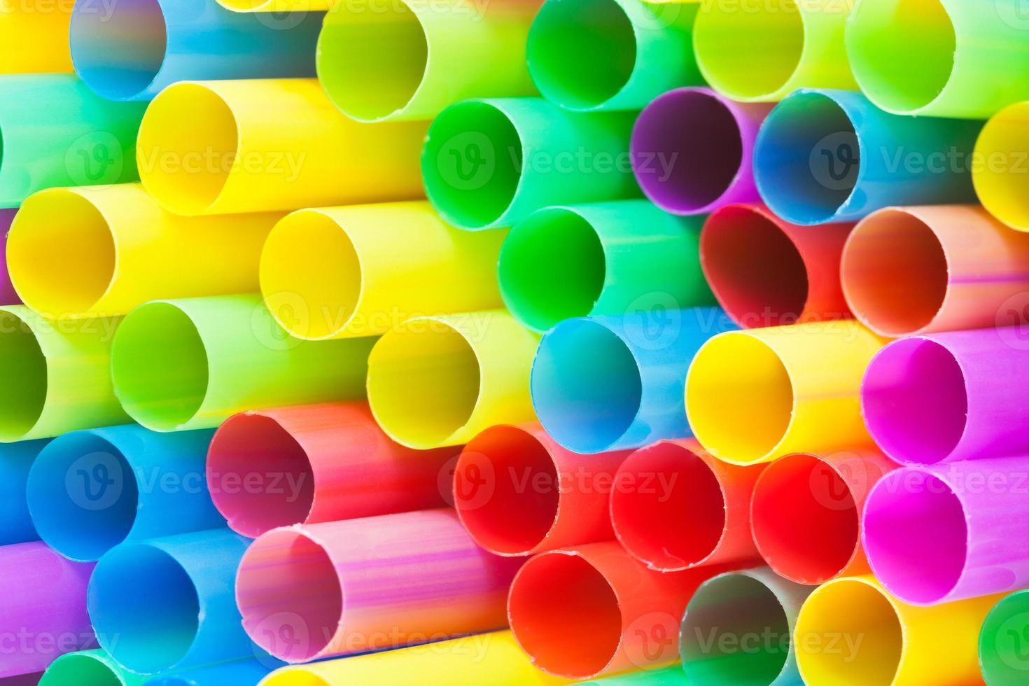 many ends of multicoloured plastic drinking straws photo