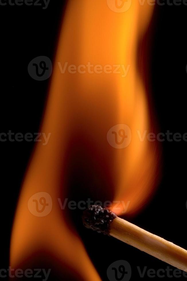 Burning matchstick and fire photo