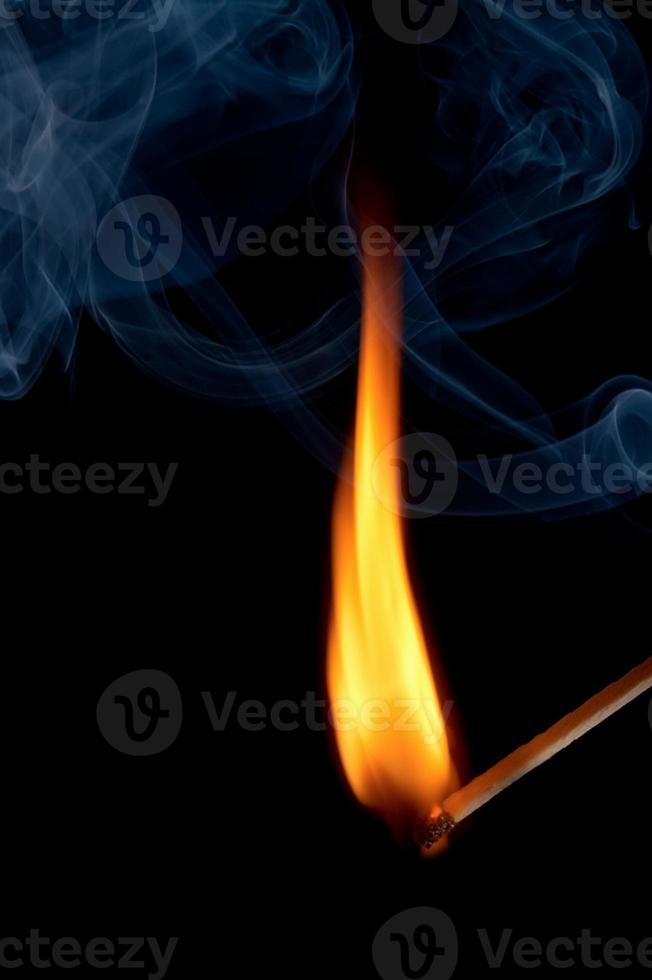 Burning matchstick and fire photo