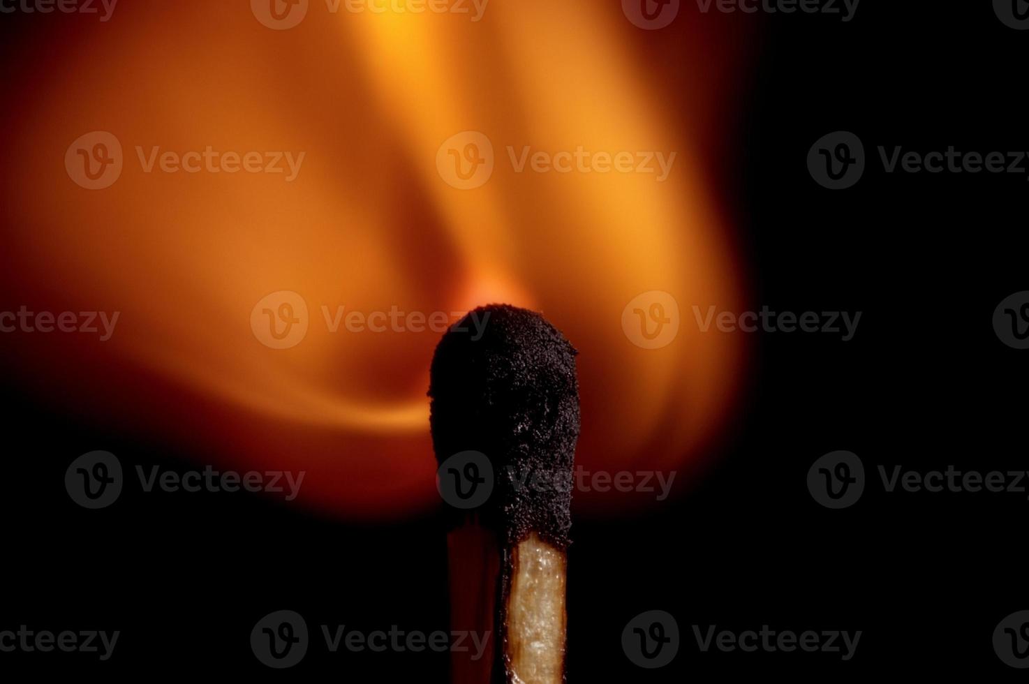 Burning matchstick and fire photo