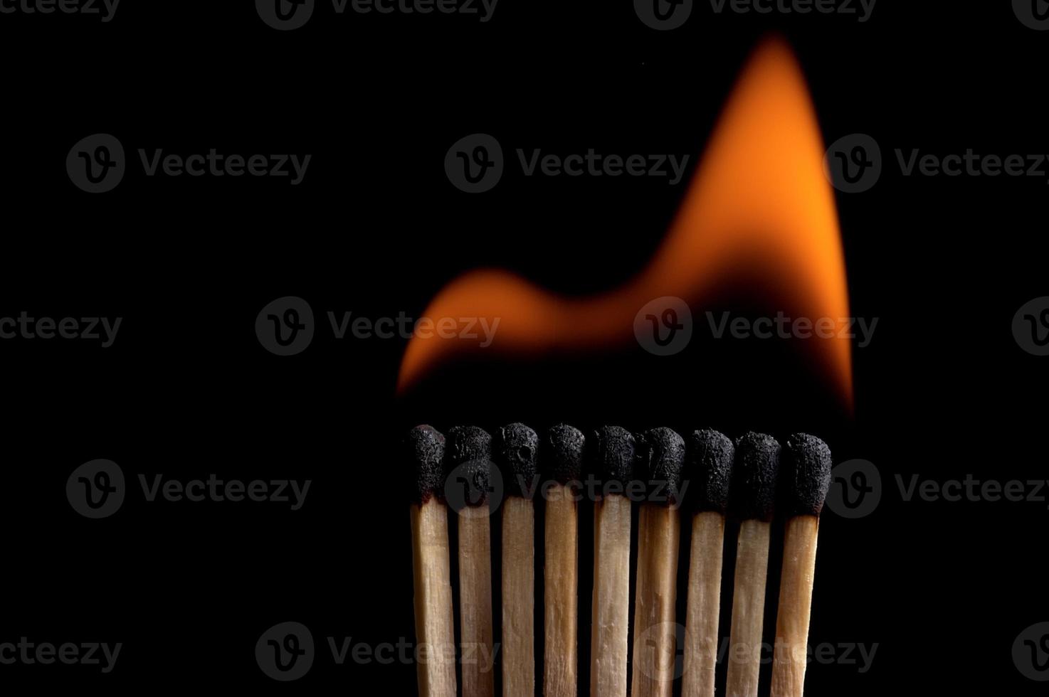 Burning matchstick and fire photo