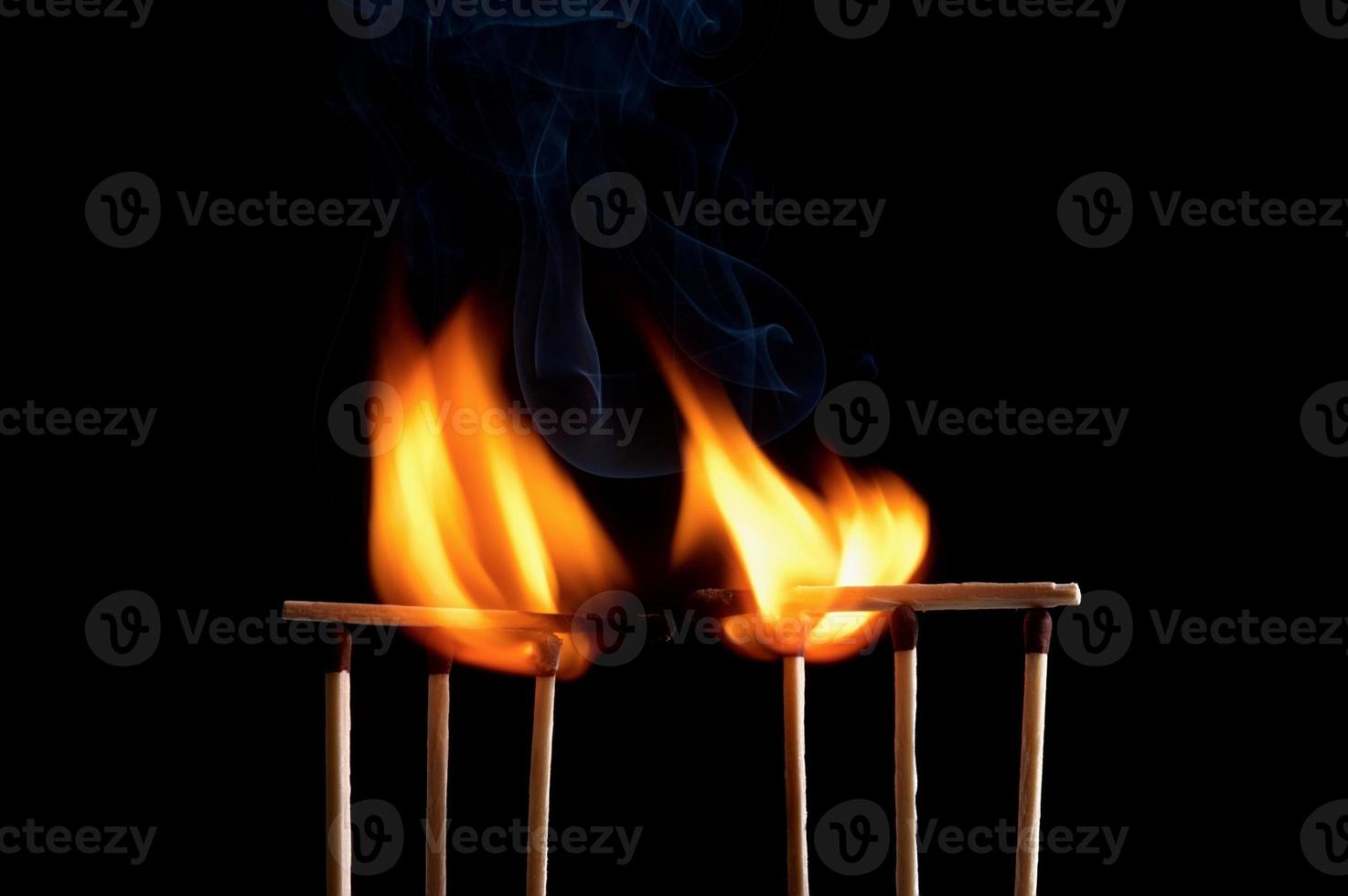 Burning match stick photo