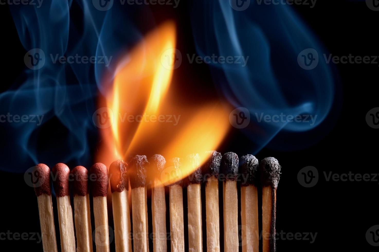 Burning match stick photo