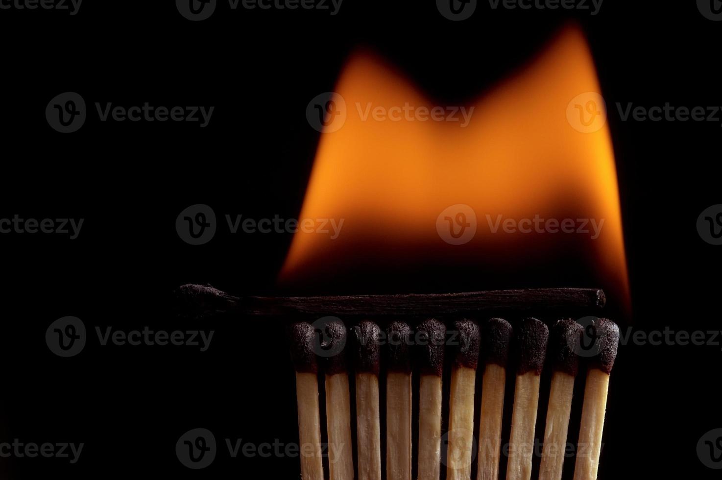 Burning matchstick and fire photo