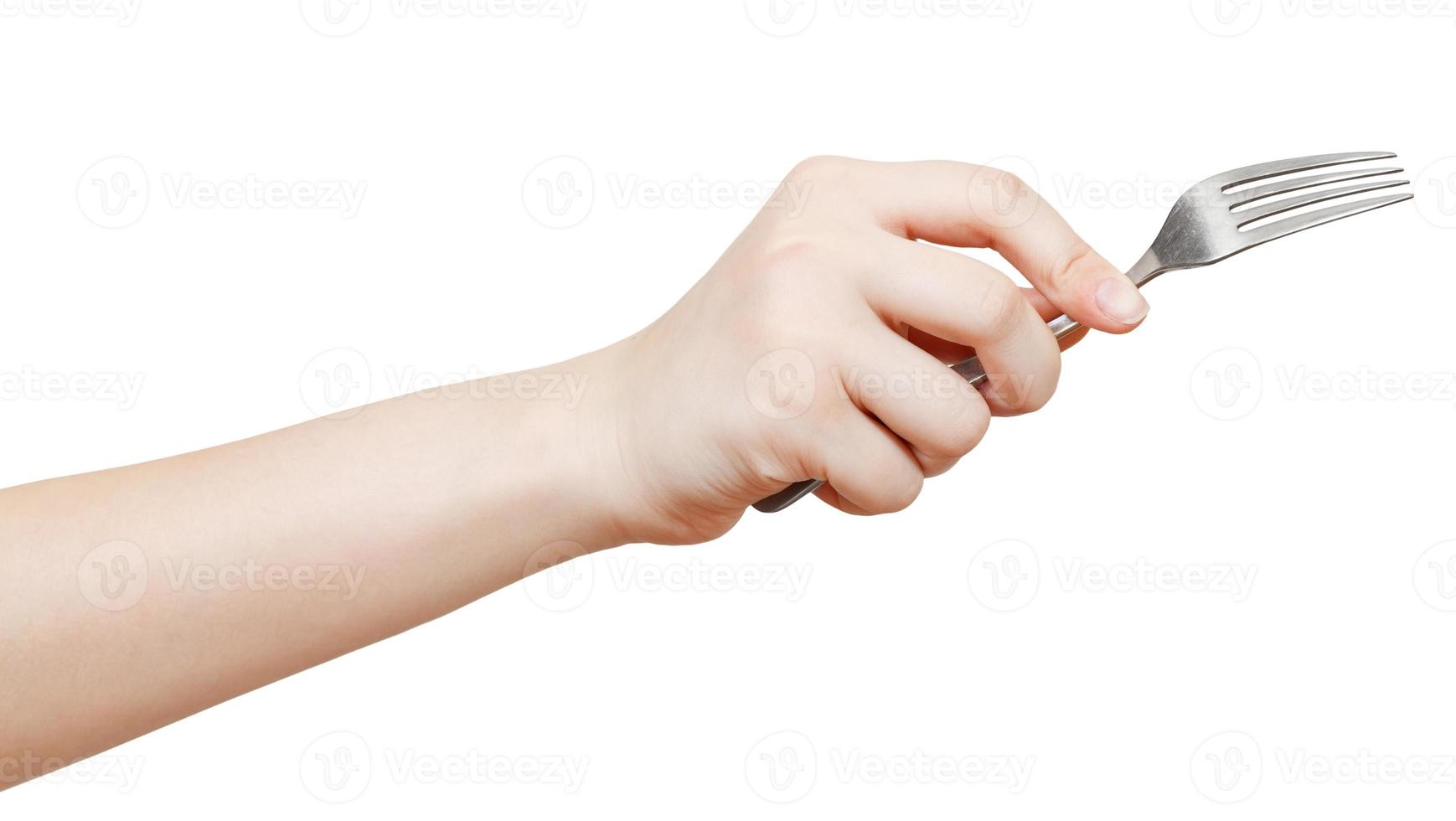 fork in female hand isolated on white photo