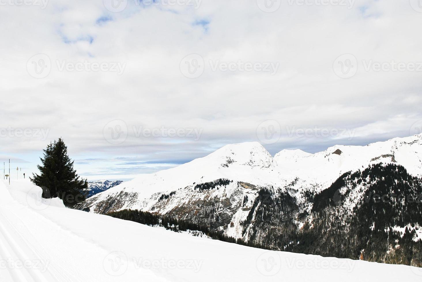 skiing run on snow mountains in Alps photo