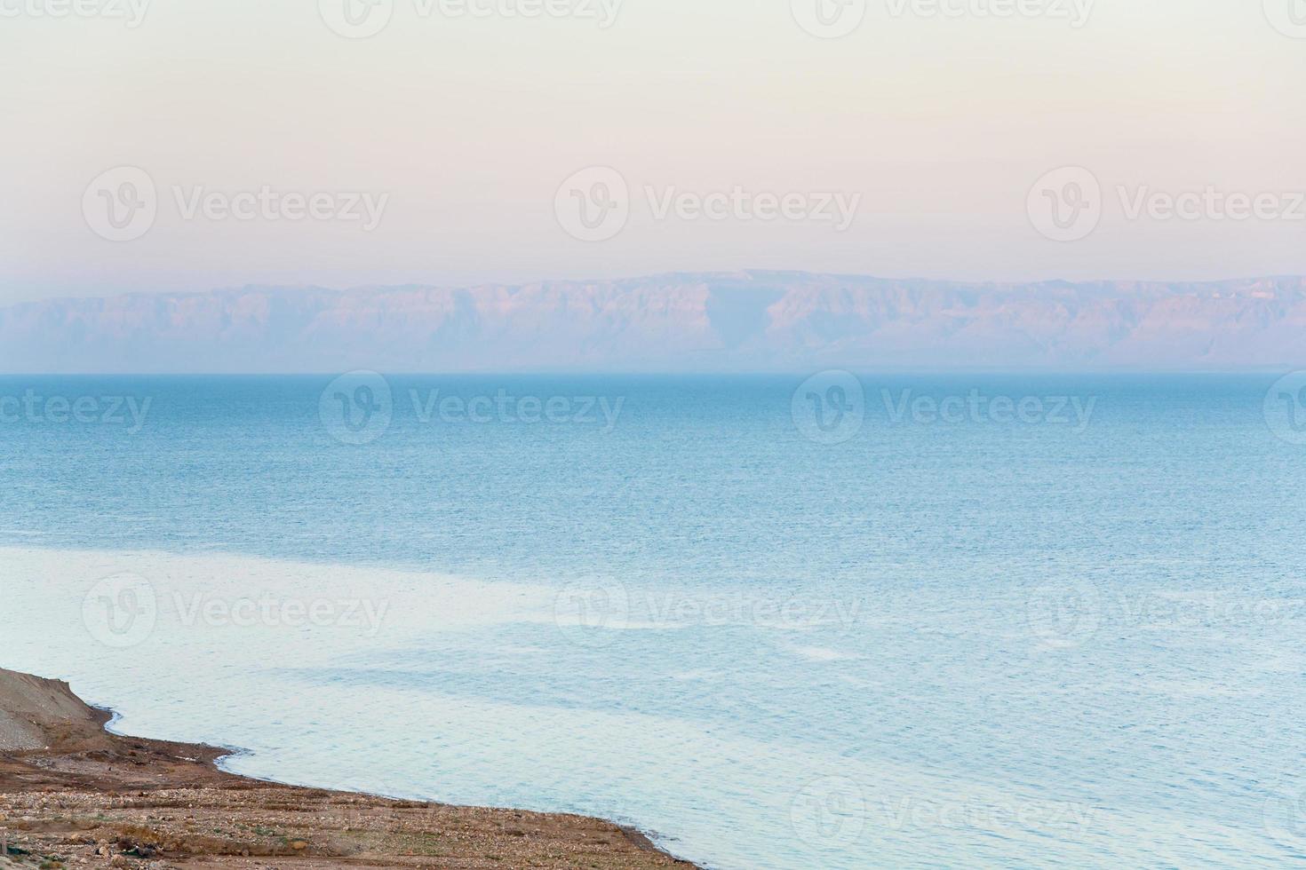 early pink sunrise on Dead Sea coast photo