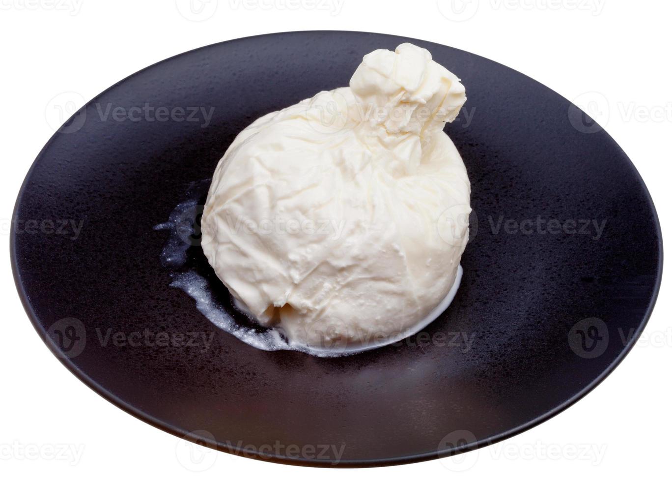 fresh italian cheese burrata on black plate photo