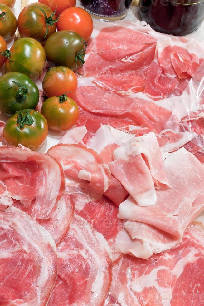 italian prosciutto, pancetta and green tomato 12045286 Stock Photo at