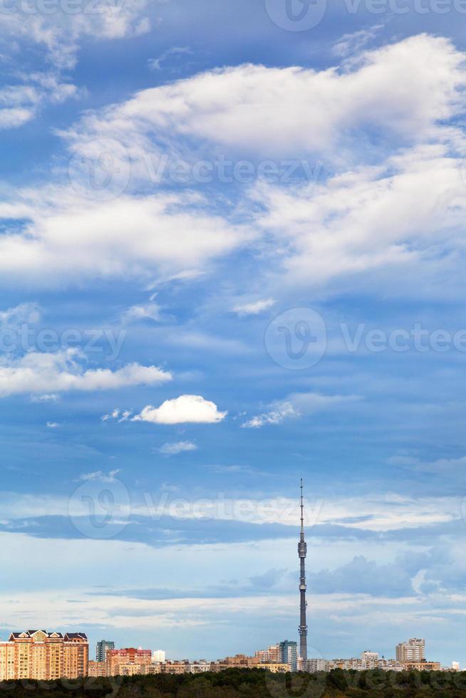 blue autumn sky with clouds under town photo