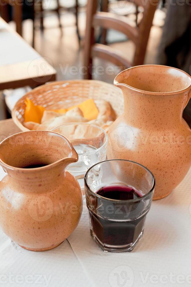rural ceramic jugs with local red wine photo
