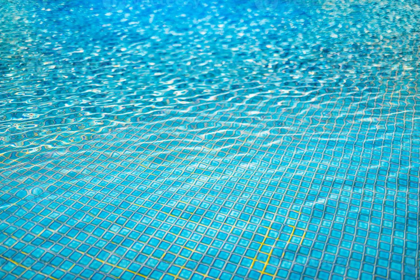 Water background, ripple and flow with waves. Summer blue swimming pool pattern. Sea, ocean surface. photo
