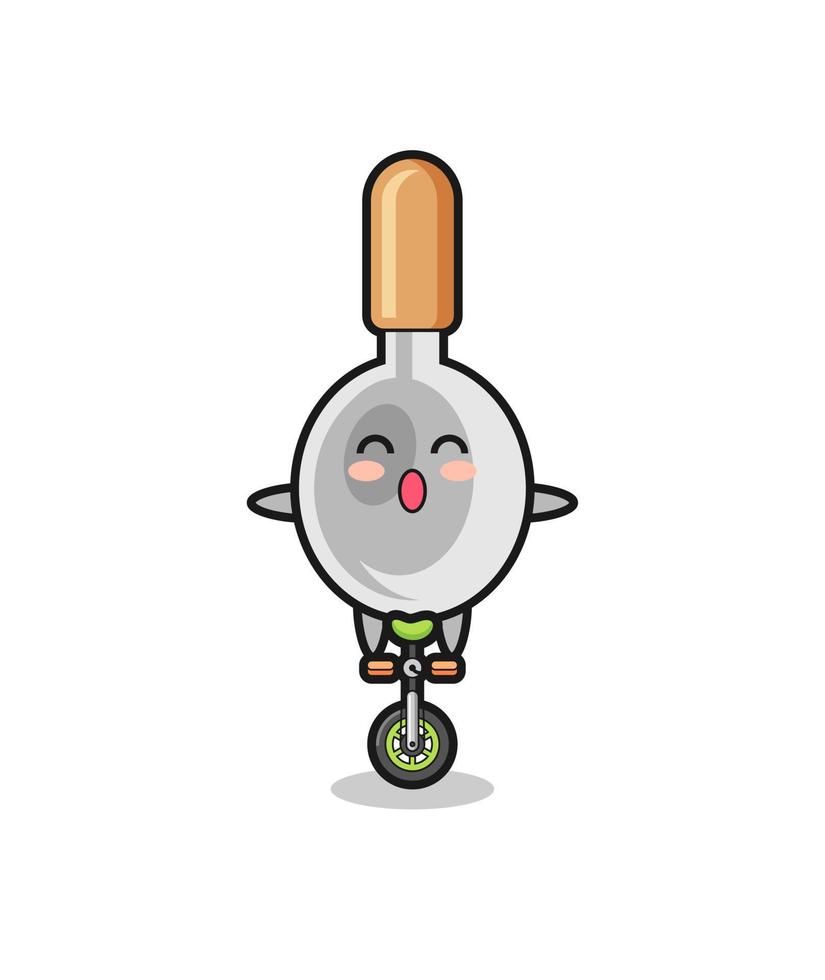 The cute cooking spoon character is riding a circus bike vector