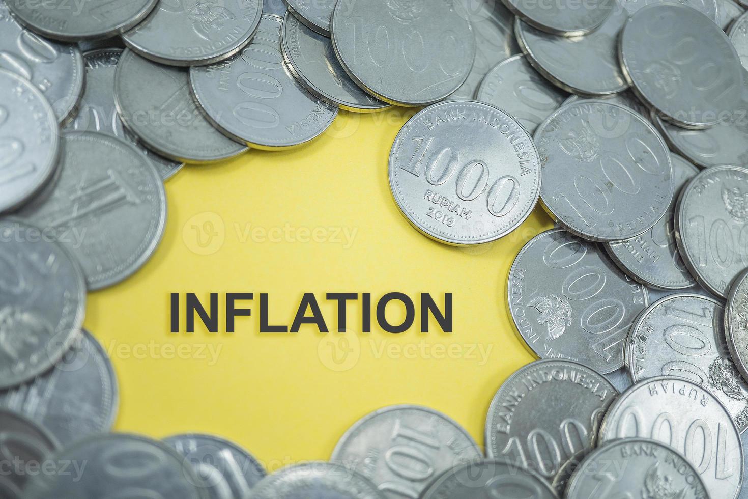 coins scattered and in the middle it says Inflation photo