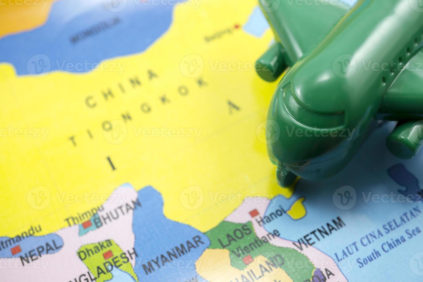 selected focus model airplane on world map background. photo