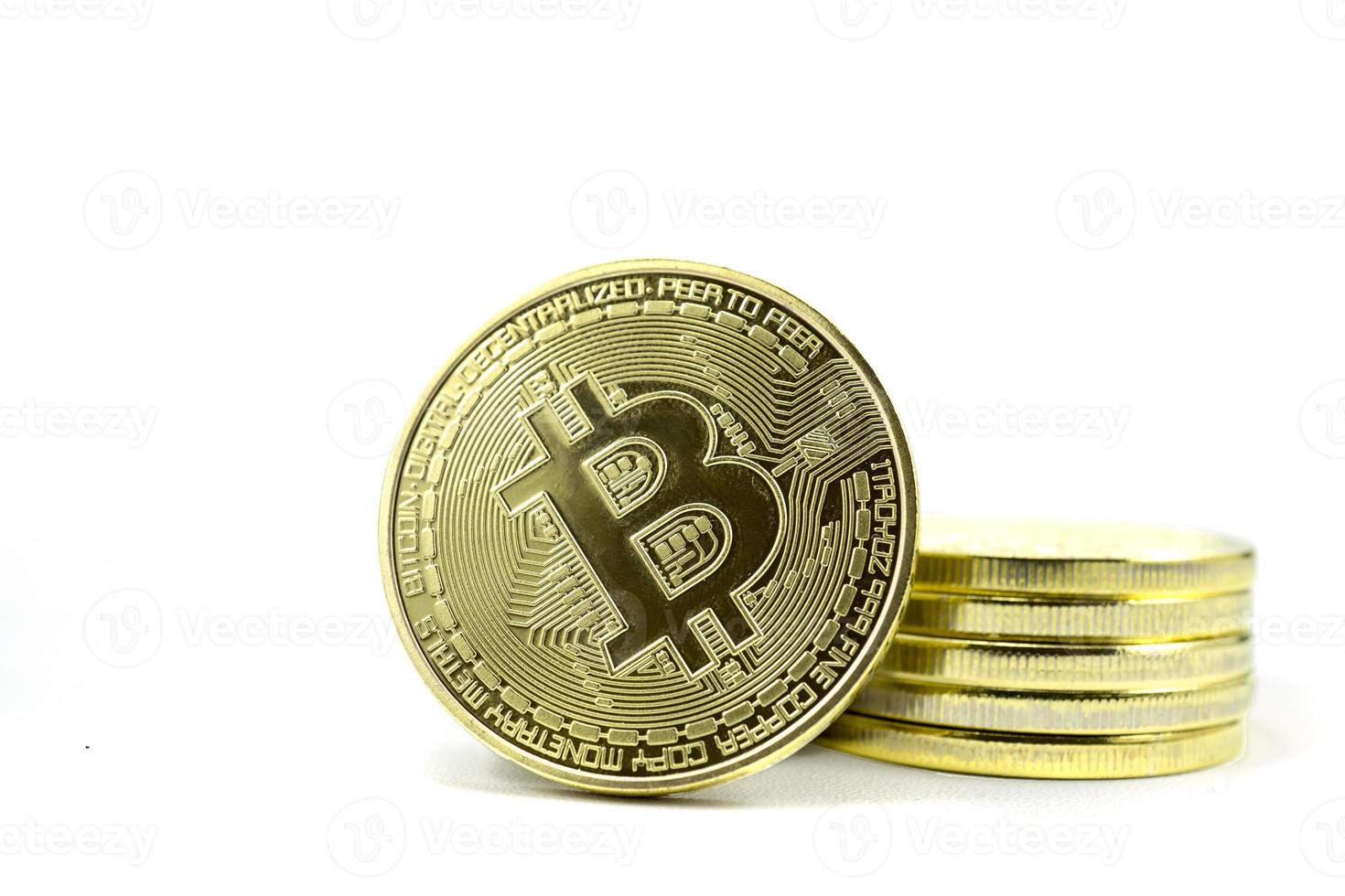 Stack of gold bitcoin coins isolated on a white background photo