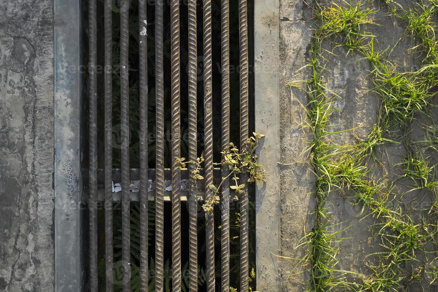 rusty brown housing scrap metal gutter. sewers for sewage and rainwater. photo