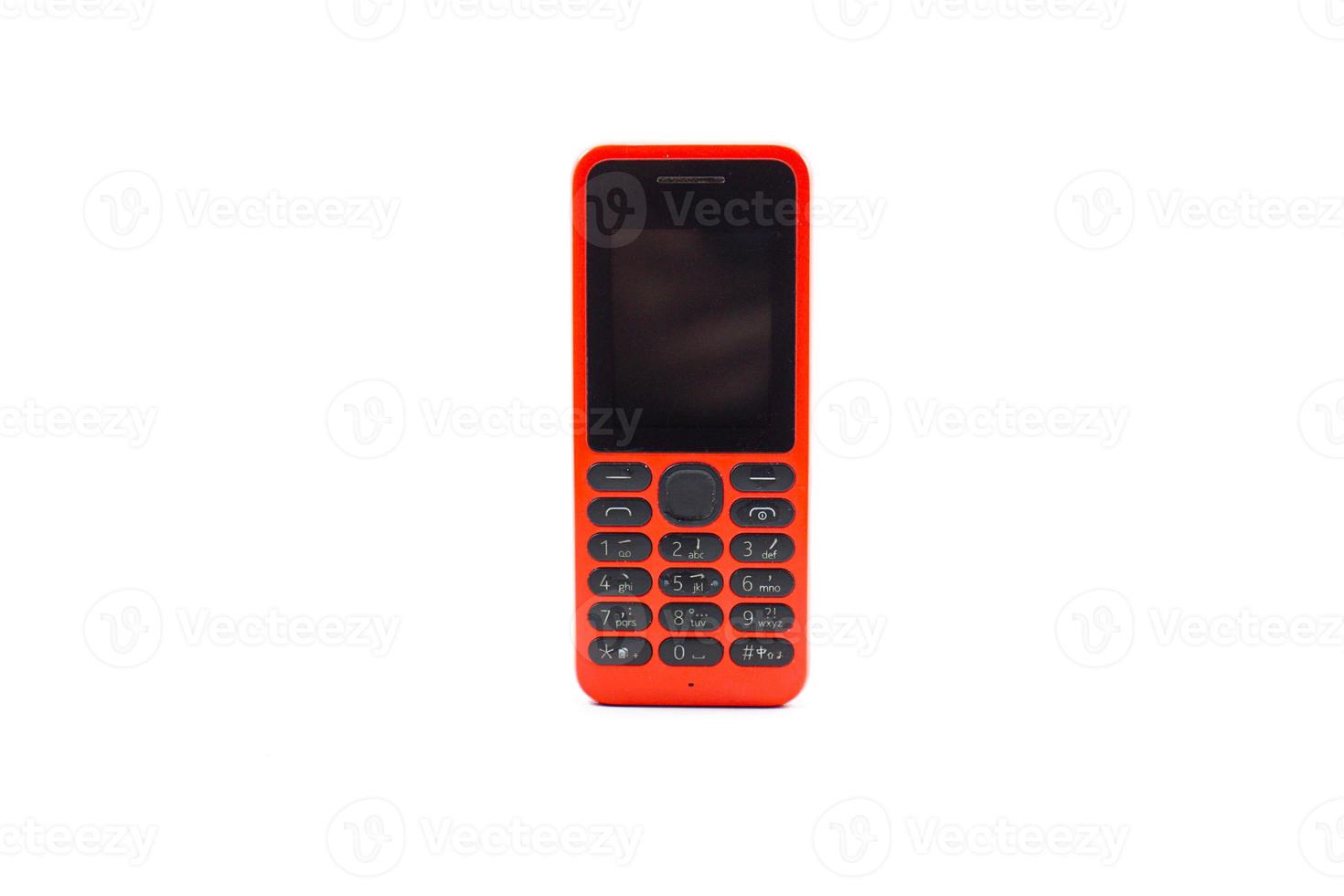 viejo teléfono celular rojo usado solo para llamar y enviar mensajes de texto o sms foto