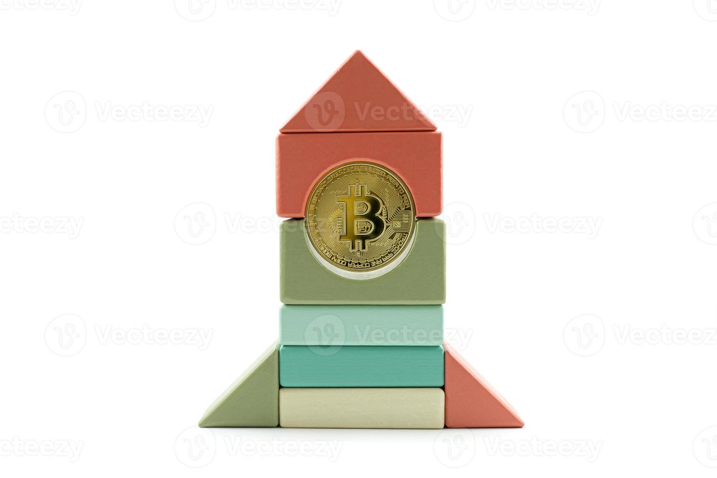 Bitcoin rate growth concept. Bitcoin rocket wooden toy flying to the moon photo