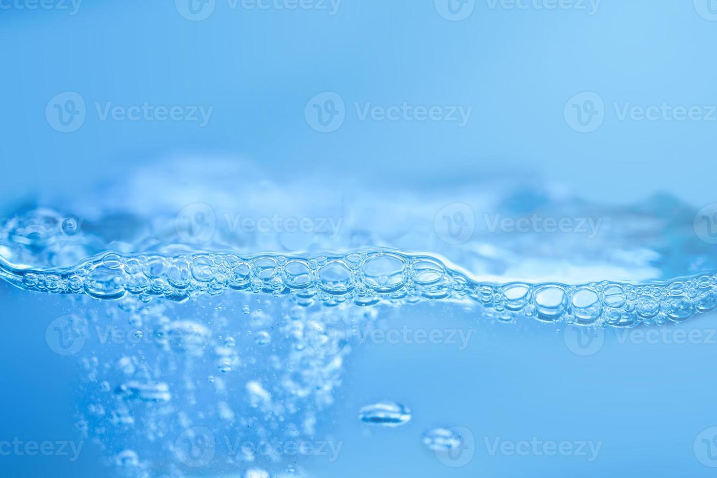 waves on the surface of clear water such as in the sea or fish tank background photo