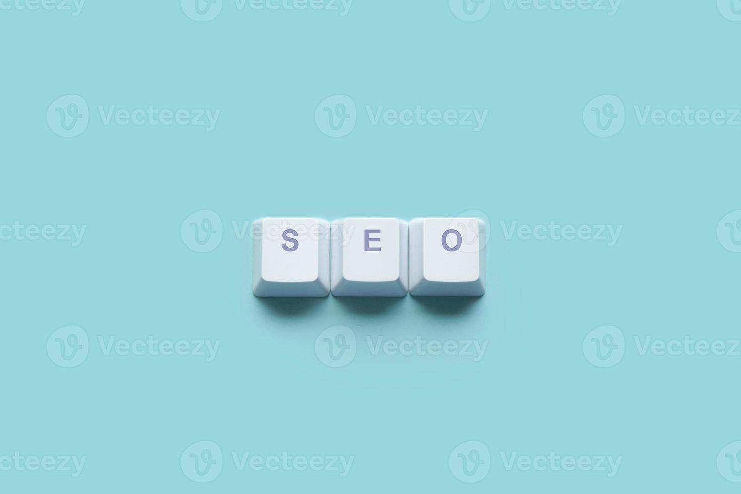 Word Search Engine Optimization SEO written on computer keyboard keys photo