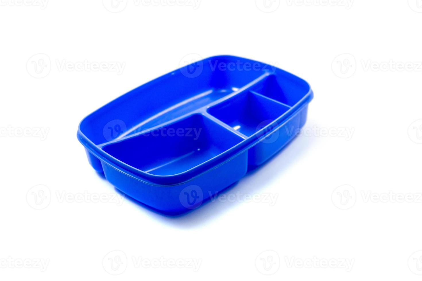 blue plastic lunch box isolated on white background. photo