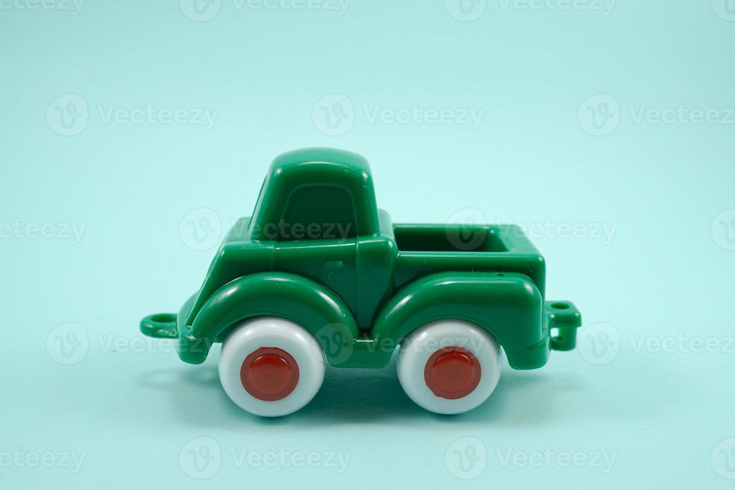 green paint plastic toy truck isolated on turquoise 12052760 Stock