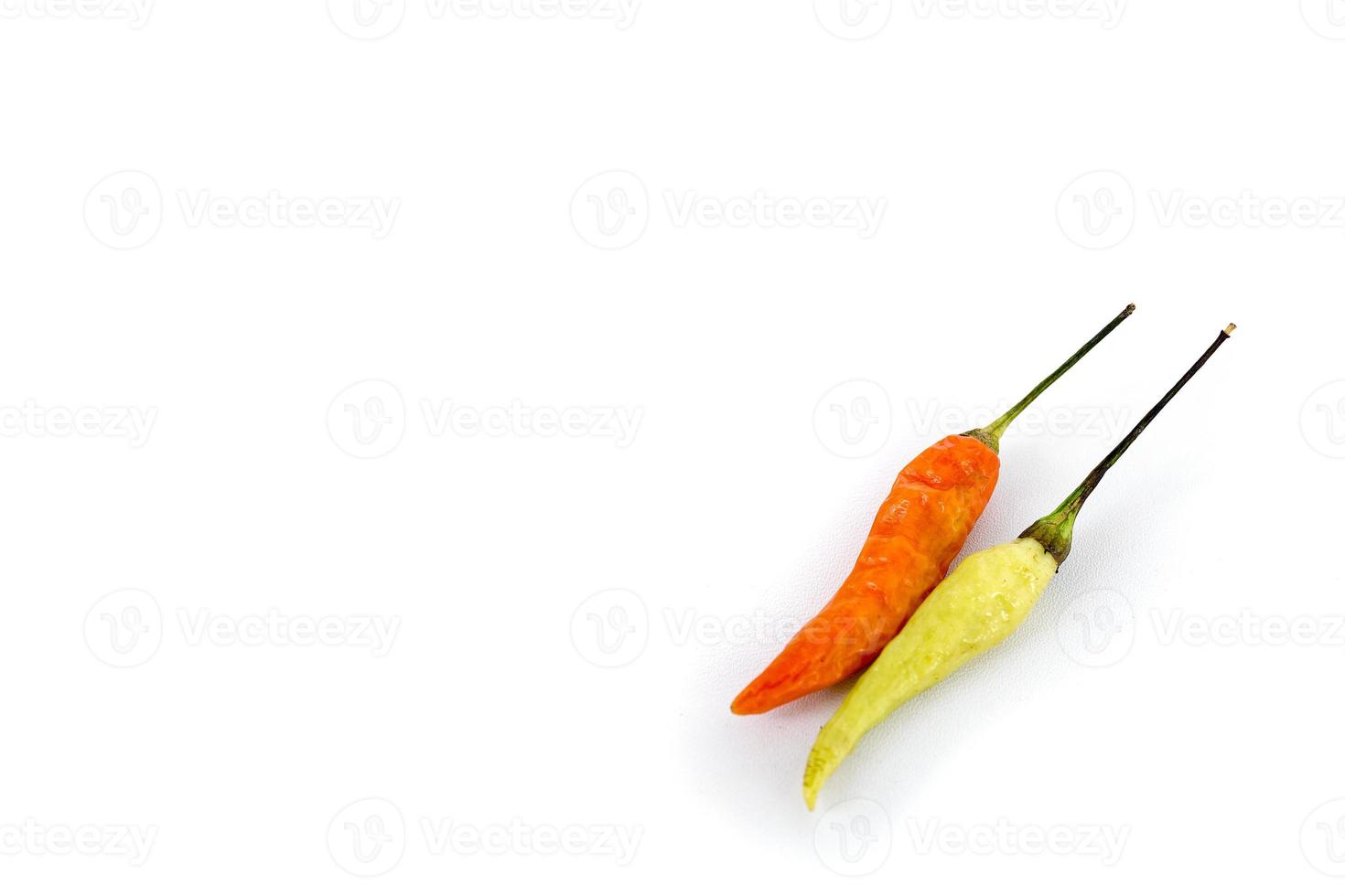 close-up of red and green chilies with white blank space background photo
