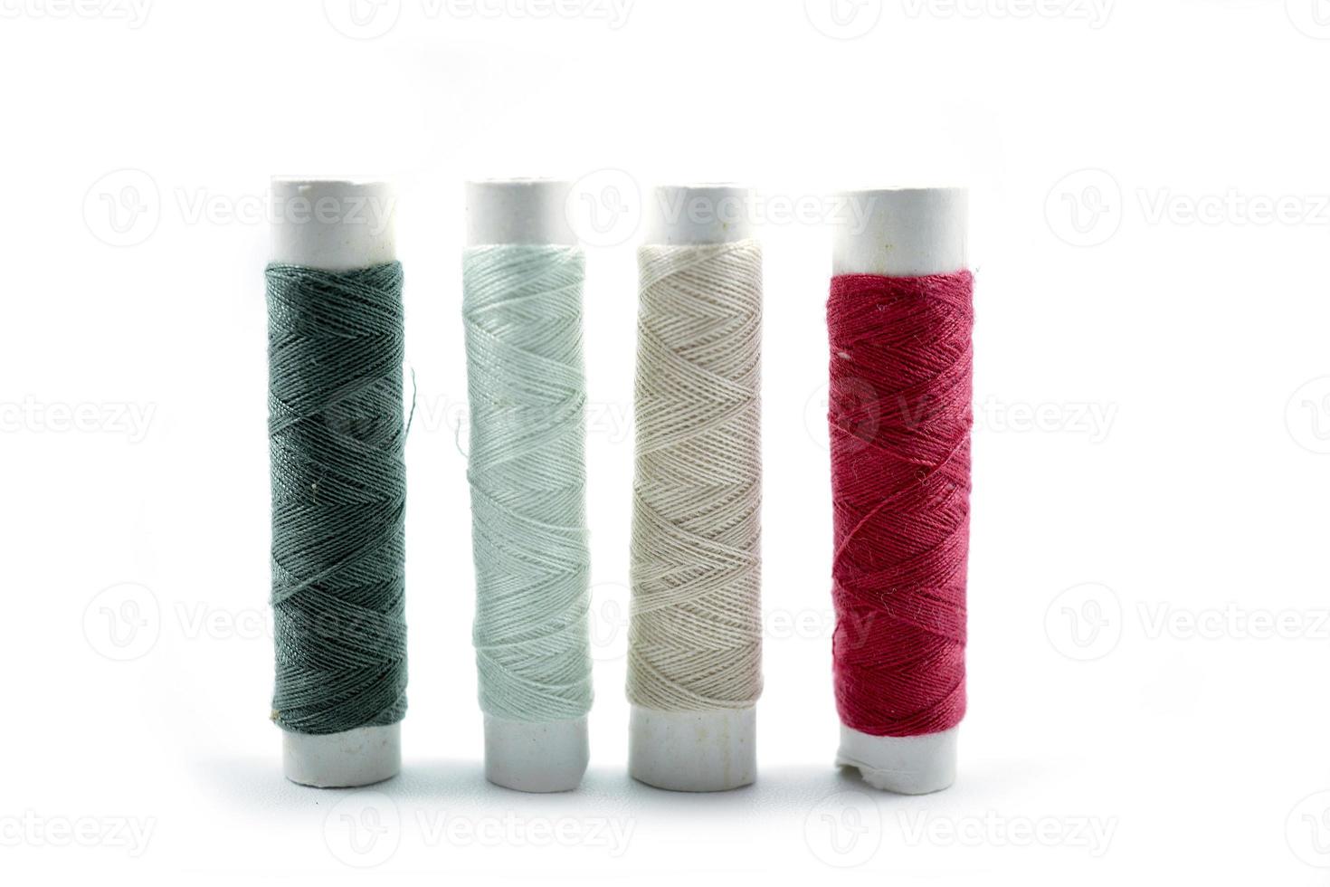 Rows of sewing threads of various colors photo