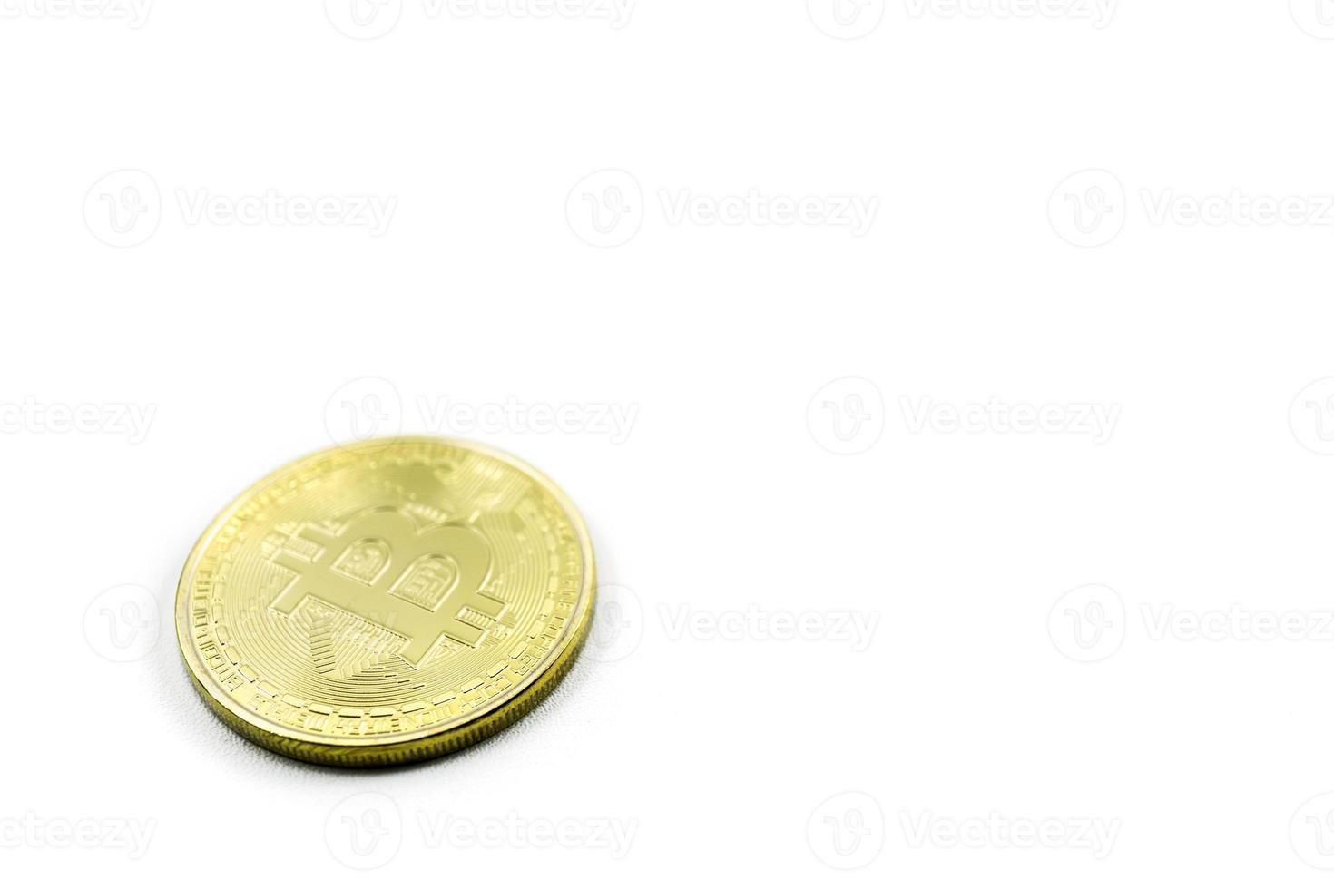 gold coins with bitcoin symbol in lower left corner isolated on white background photo