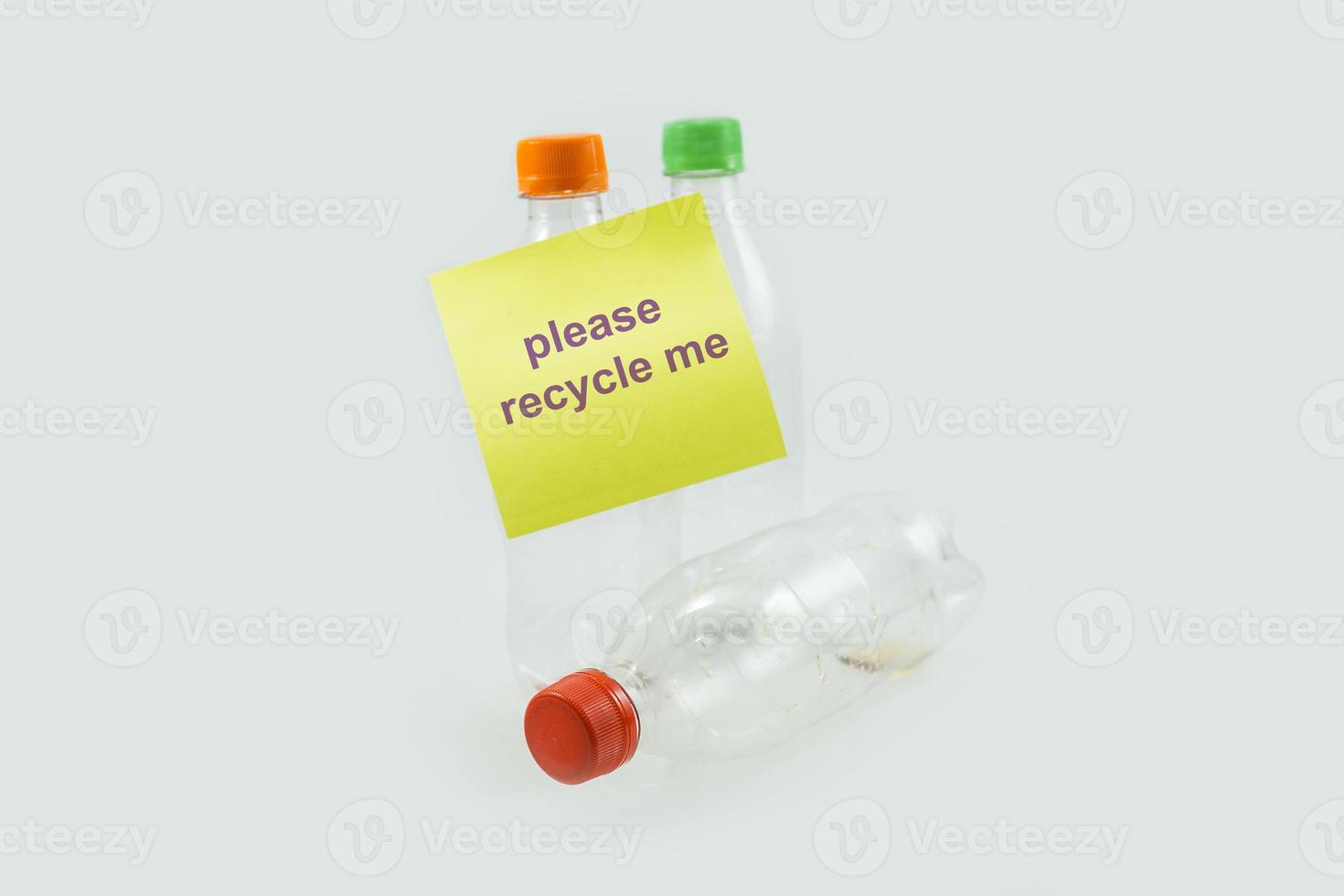 close-up of used plastic bottles for recycling with sticky notes photo