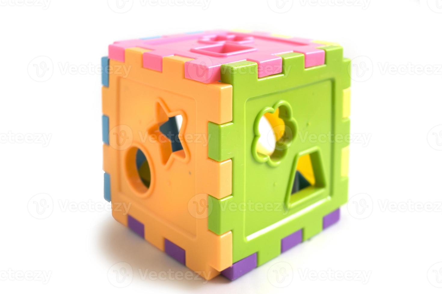 children's toy cube puzzle to recognize shapes, educational toys. photo