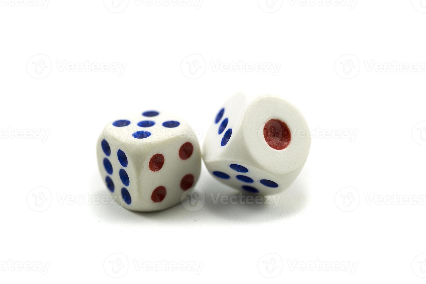 Three plastic dice isolated on a white background, a dice is a small object photo