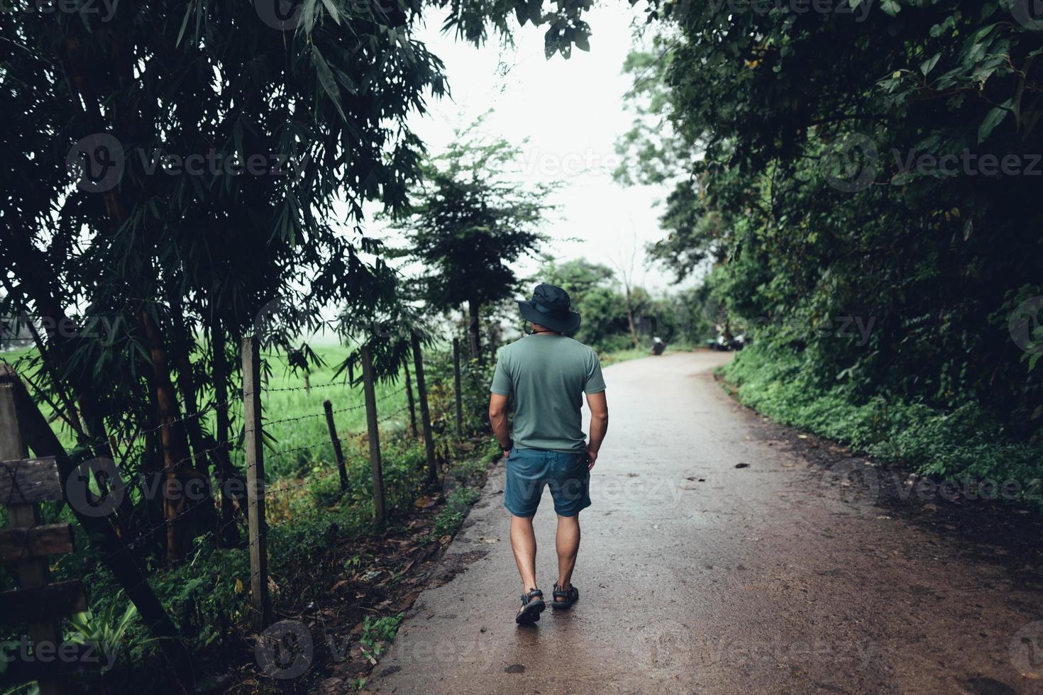 Green rice terraces and huts in the rainy season photo